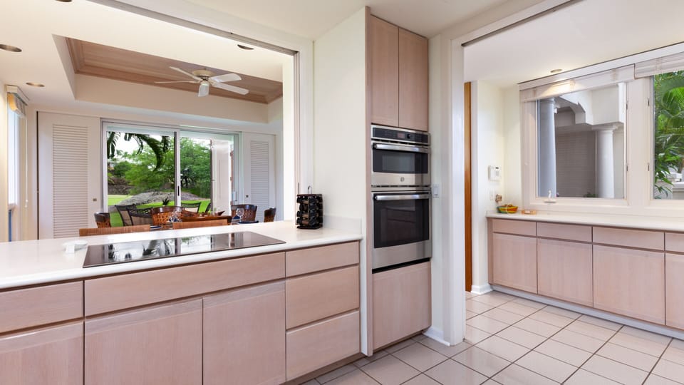 Newly updated appliances in the spacious kitchen. A nice assortment of spices and oils are provided.