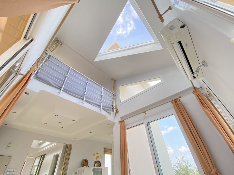 The third bedroom (upstairs) visible from dining area (downstairs).