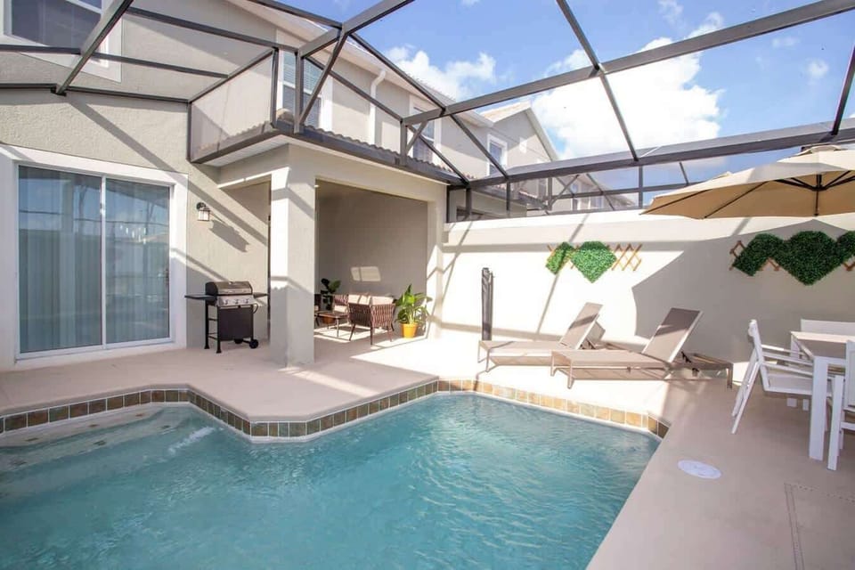screened in pool w outside patio furniture  