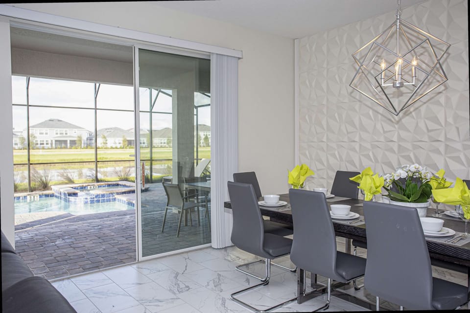 Dining Area
Enjoy meals together at the spacious table for 10, perfect for group dining.