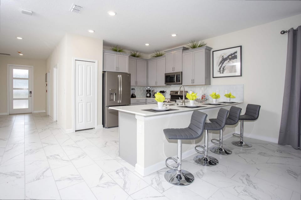 Modern Kitchen Island
Gather around the sleek island with seating for four—perfect for casual meals or morning coffee.
