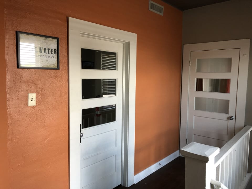 Large landing at the top of the stairs provides ample storage area.