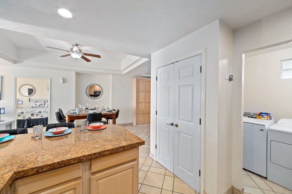 Convenient in-unit washer and dryer just off the kitchen – perfect for extended stays or beach cleanups.