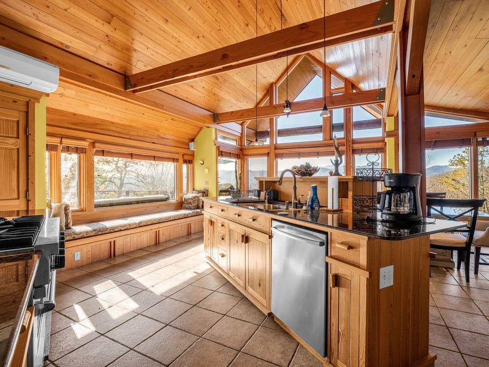 Well appointed gourmet kitchen and seating with long range views.