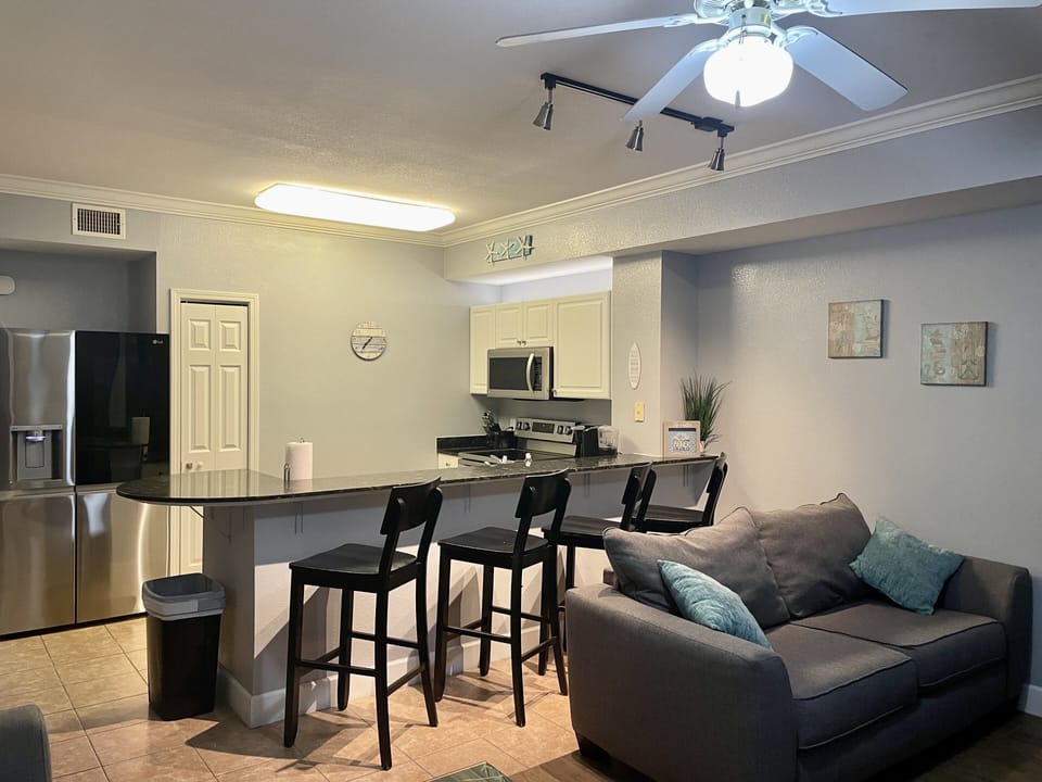 Seating for 4 at the bar and loveseat for additional enjoyment of the living rm.