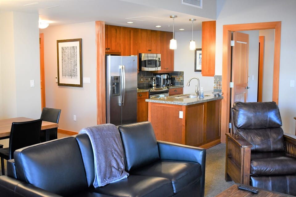 Large open living room, kitchen and dining area.