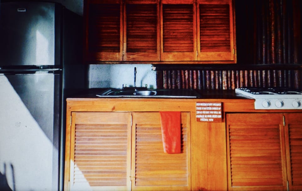 The kitchenette has a counter and high stools where you can enjoy meals as well.