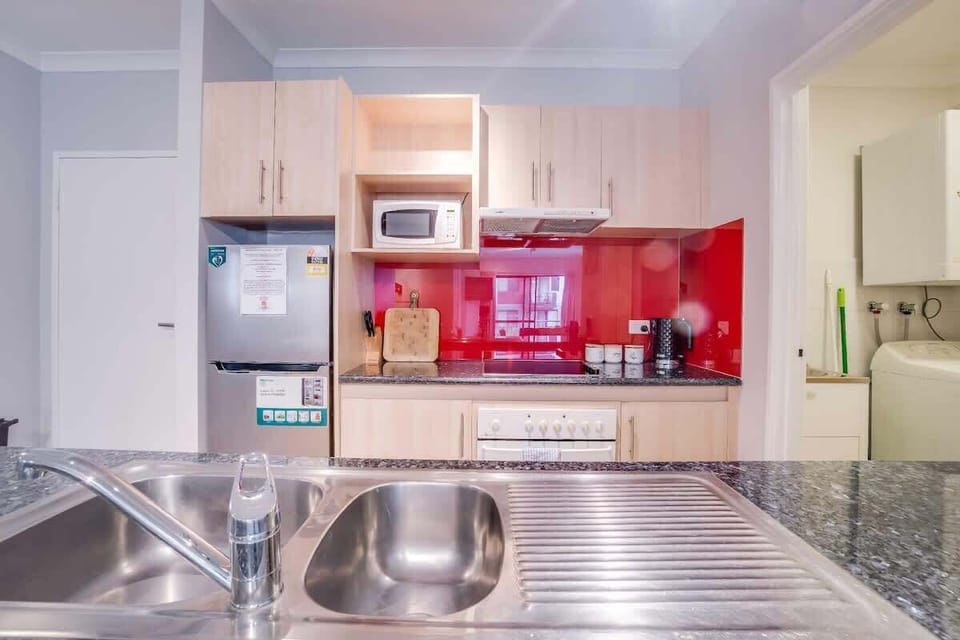 Kitchen - Crockery & cutlery provided along with basic kitchen amenities.