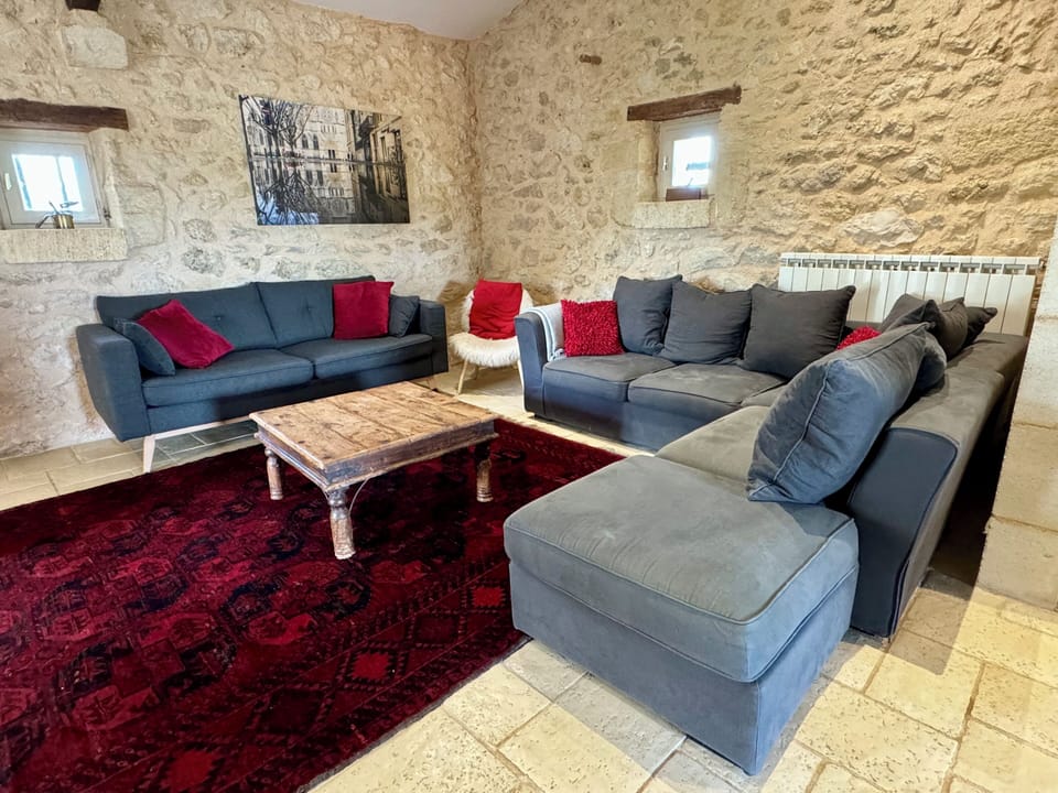 The large living room has comfy seating and a flat screen tv.