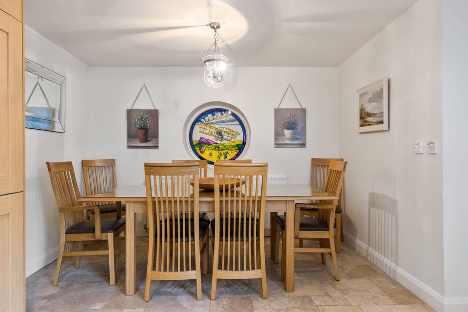 Kitchen has a dining area to one end which comfortably seats 8. 