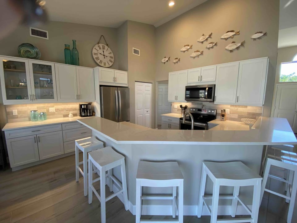 Nice open kitchen with bar seating for 6