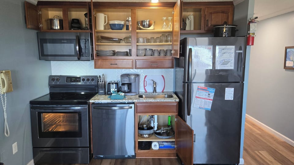 Pots and Pans stored in stove drawer.
Eating and cooking utensils in drawers. 