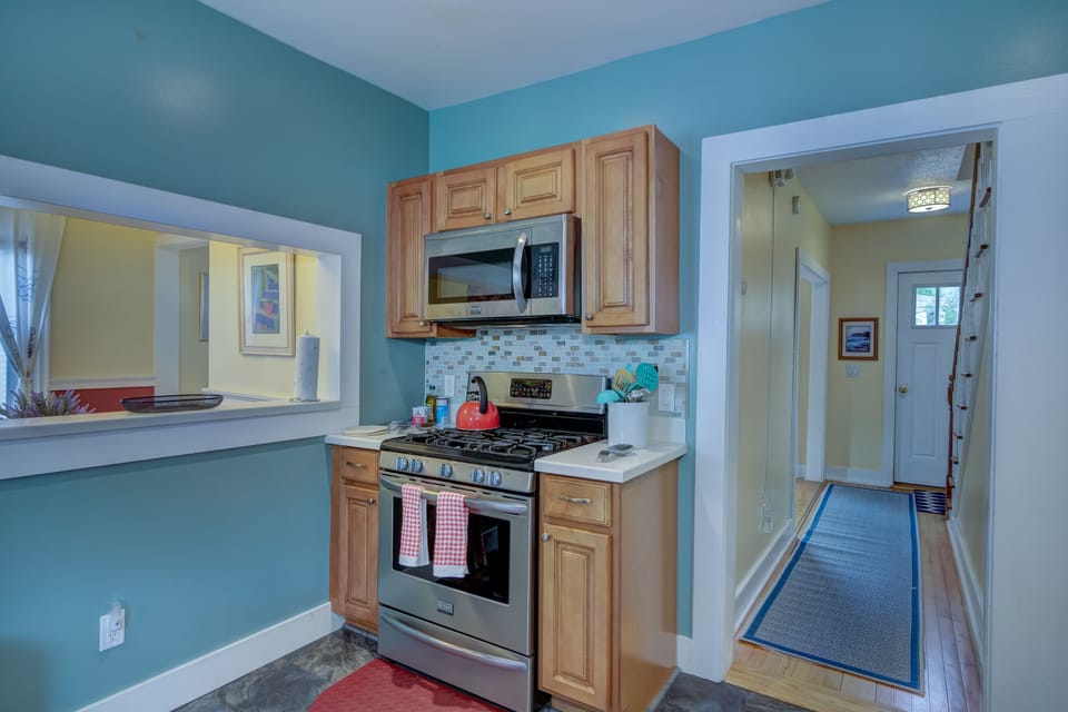 Gas Oven with Basic Baking Wares. Microwave for quick meal warming. 