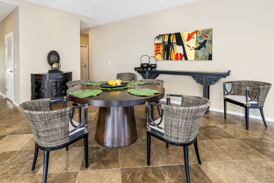 Gather at the round dining table for morning Kona coffee or sunset meals with your loved ones.
