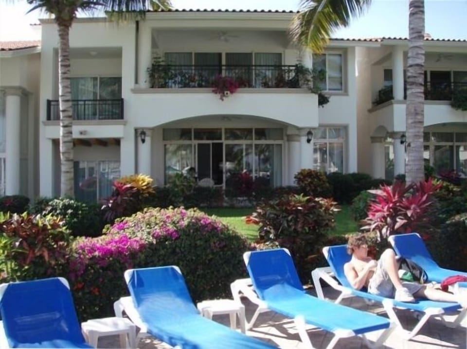 back view of villa - patio on main floor and master bedroom patio above