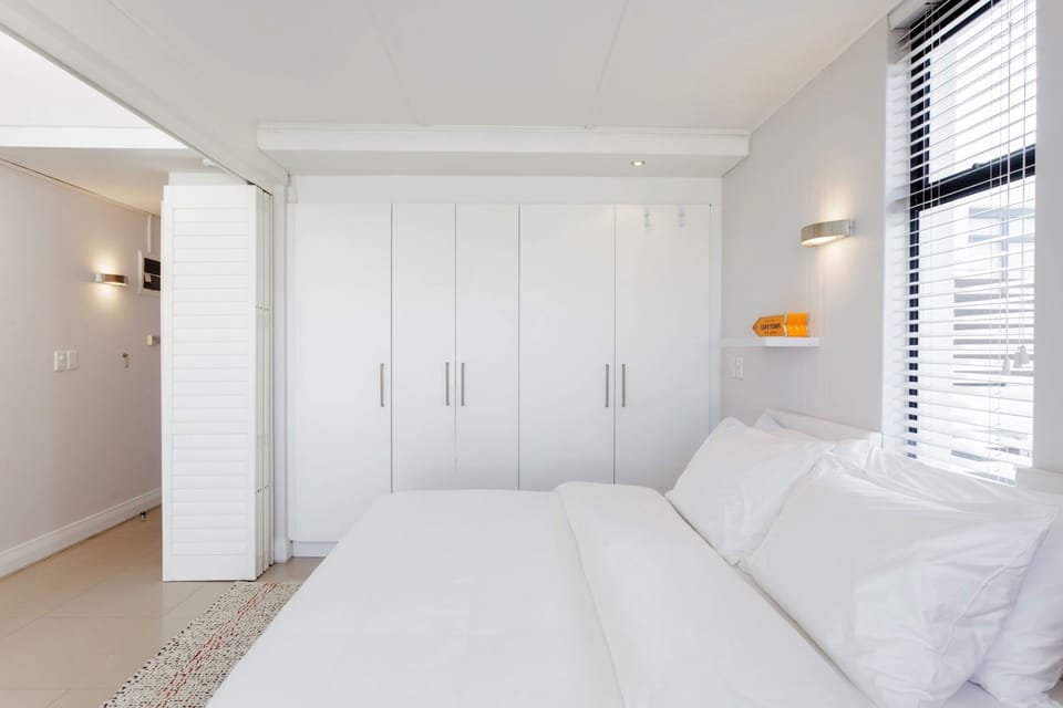 High quality linens and a comfortable bed. Large cupboards leading into bathroom