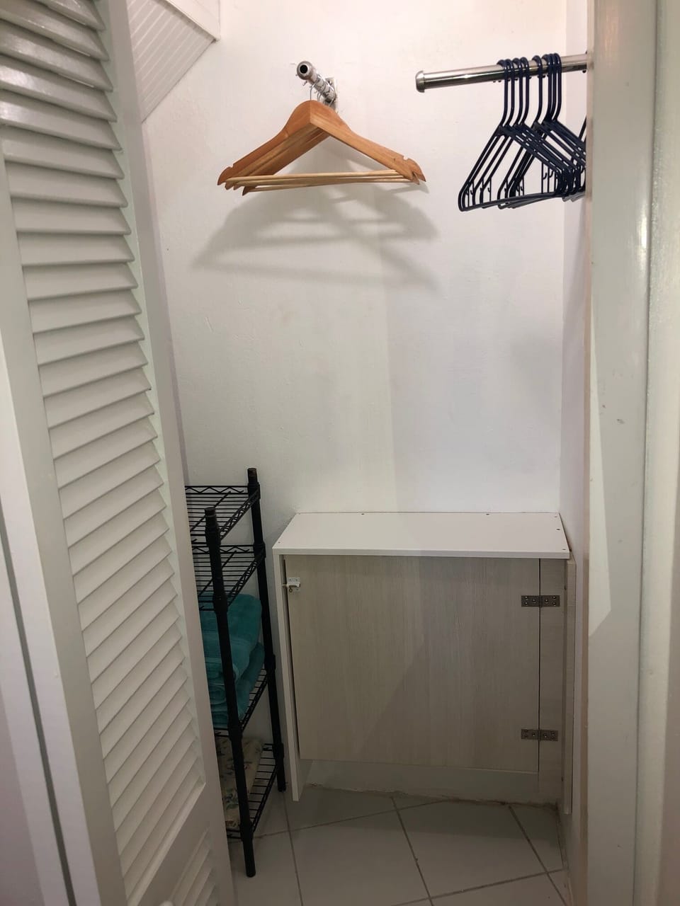 small walk-in closet in bedroom
