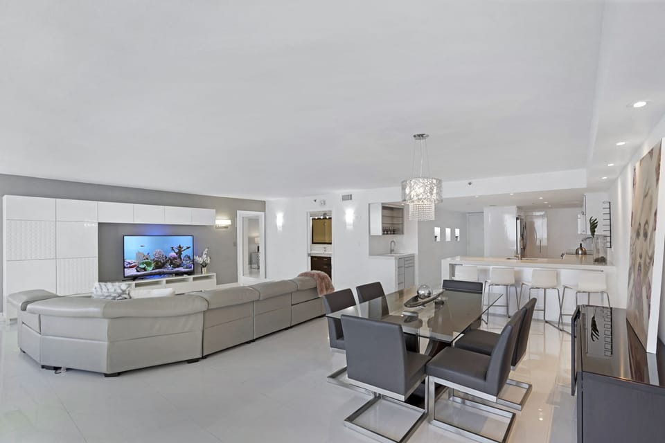 Living room, dining area, balcony access, Roku streaming Tv