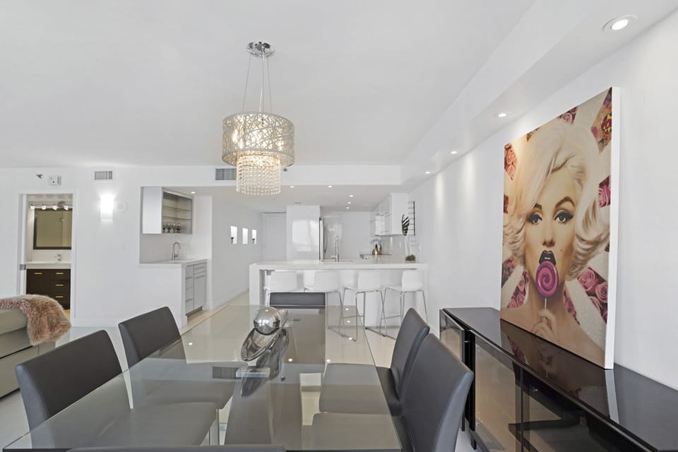Dining area, fully equipped kitchen, balcony access, Roku streaming Tv 