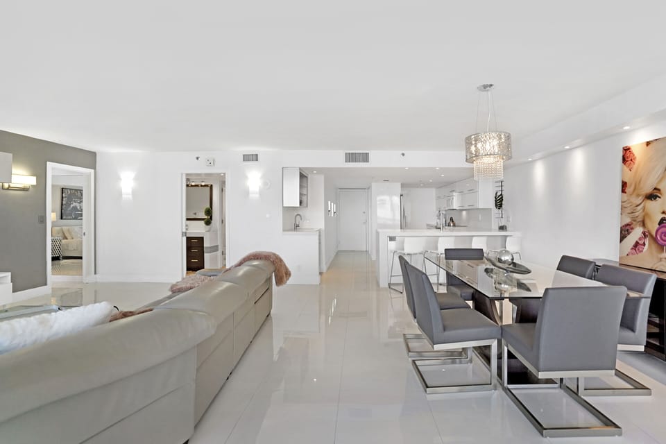 Living room, dining area, balcony access, Roku streaming Tv