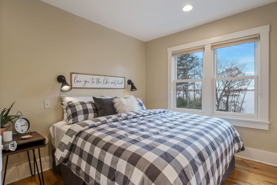 Master bedroom with beautiful views of the lake. 