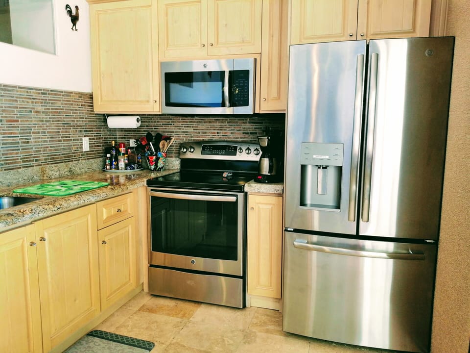 Refrigerator with in-door filtered water and ice.