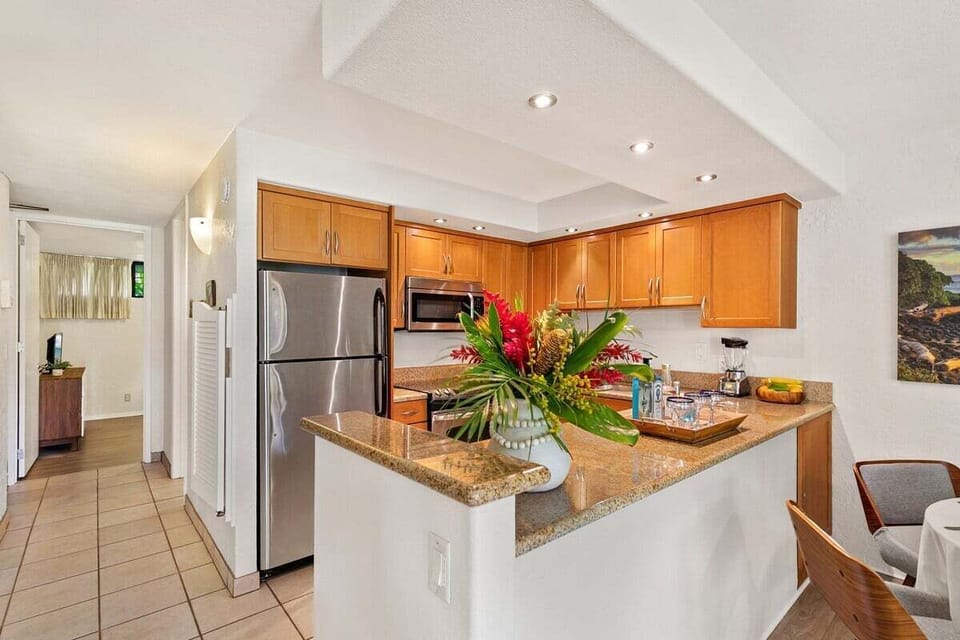 Cook in a modern kitchen accented with tropical touches.