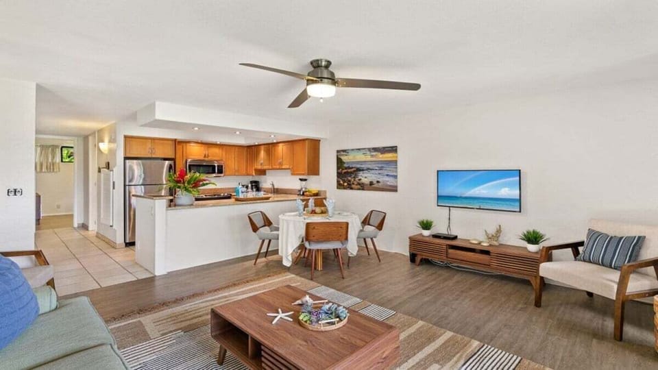 Cook in a modern kitchen framed by wood and steel.