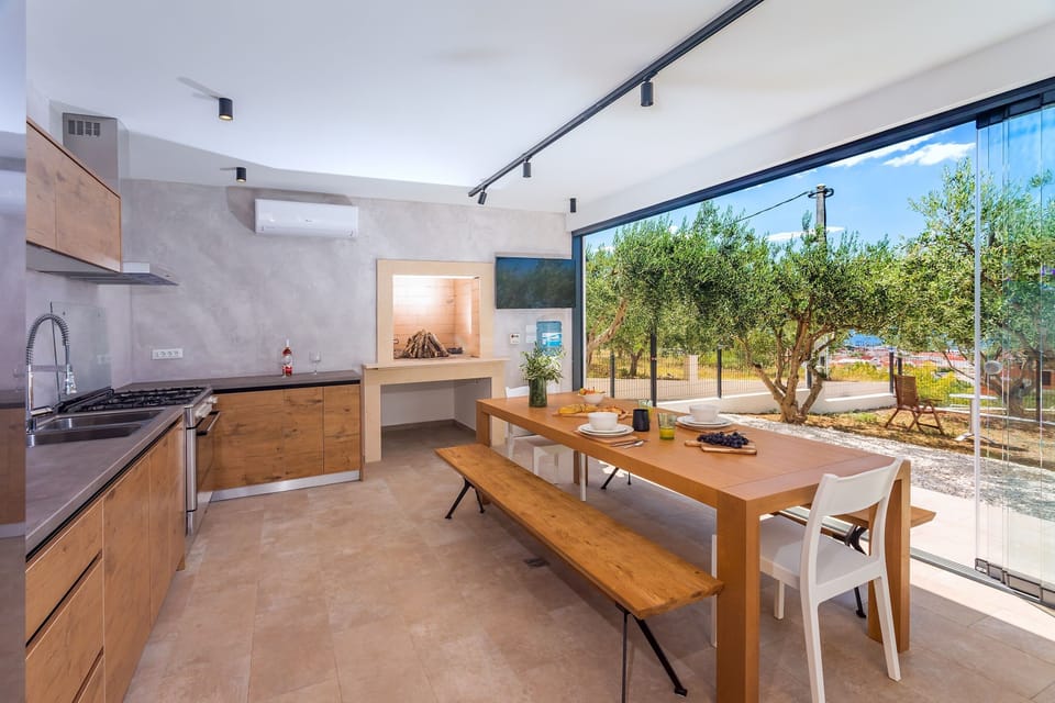 A glass wall provides views on the pool and outdoor area.