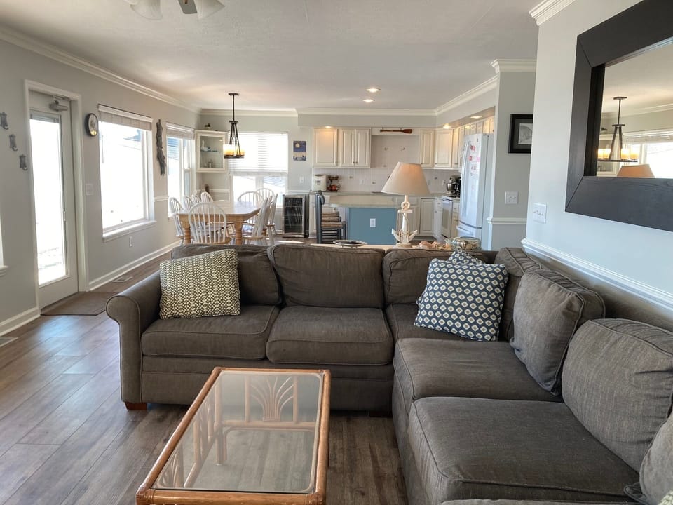 Downstairs living area with view of kitchen and eating area