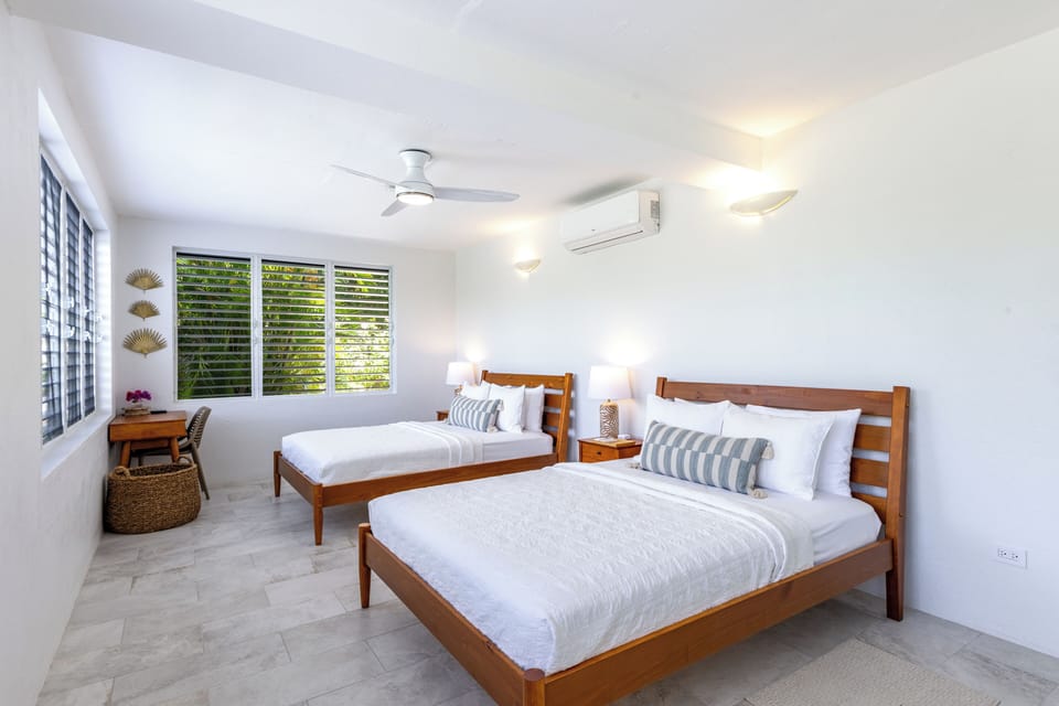Downstairs bedroom with 2 Queen beds