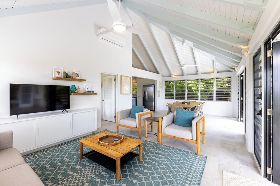 Open floor plan living and dining, vaulted ceilings