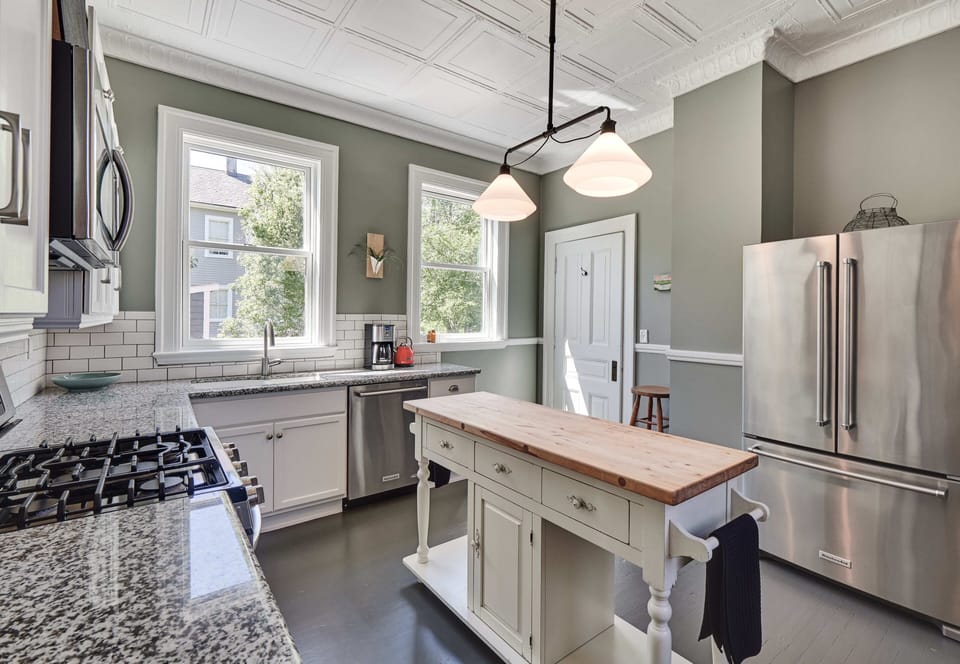 Kitchen with granite countertops and stainless steel appliances.