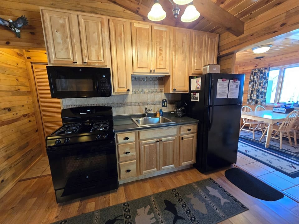 Small kitchen with black appliances