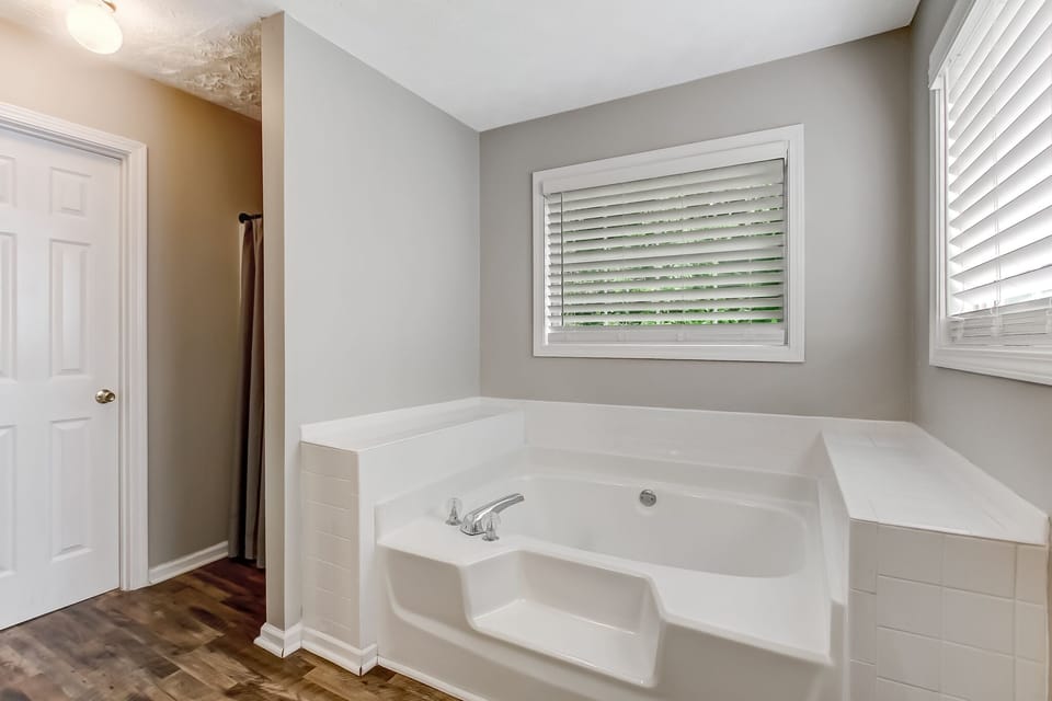 Primary ensuite bathroom with soaking tub