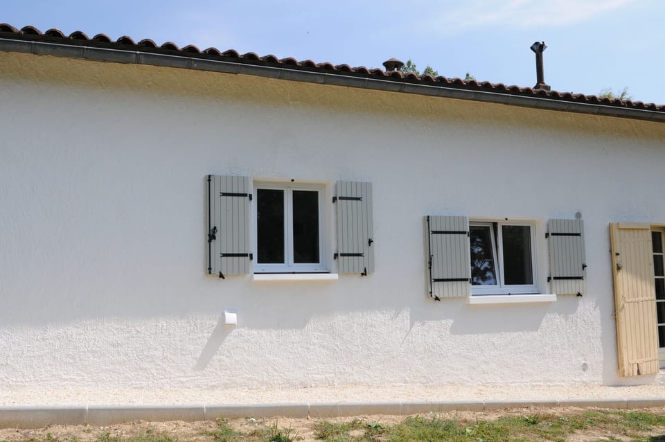 Shuttered windows to Utility Room and Kitchen