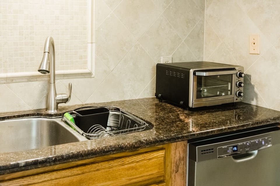 Fully equipped kitchen with gas range, toaster oven, microwave and more.