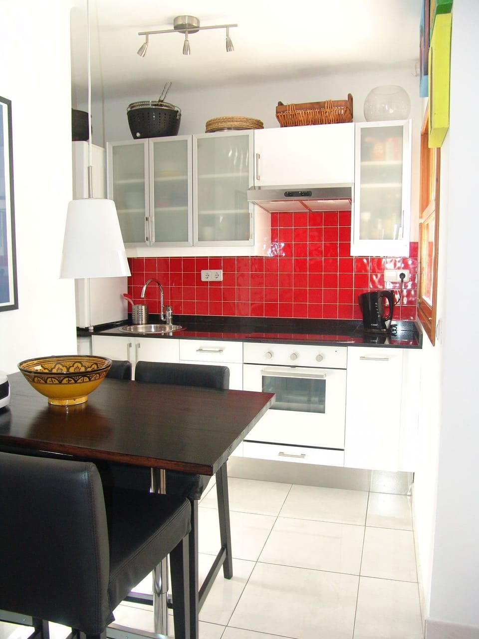 Kitchen with open serving window to the balcony