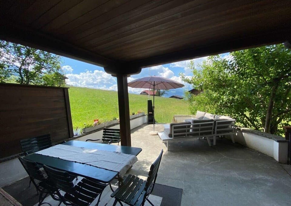 spacious patio with a dinning table and sitting area 