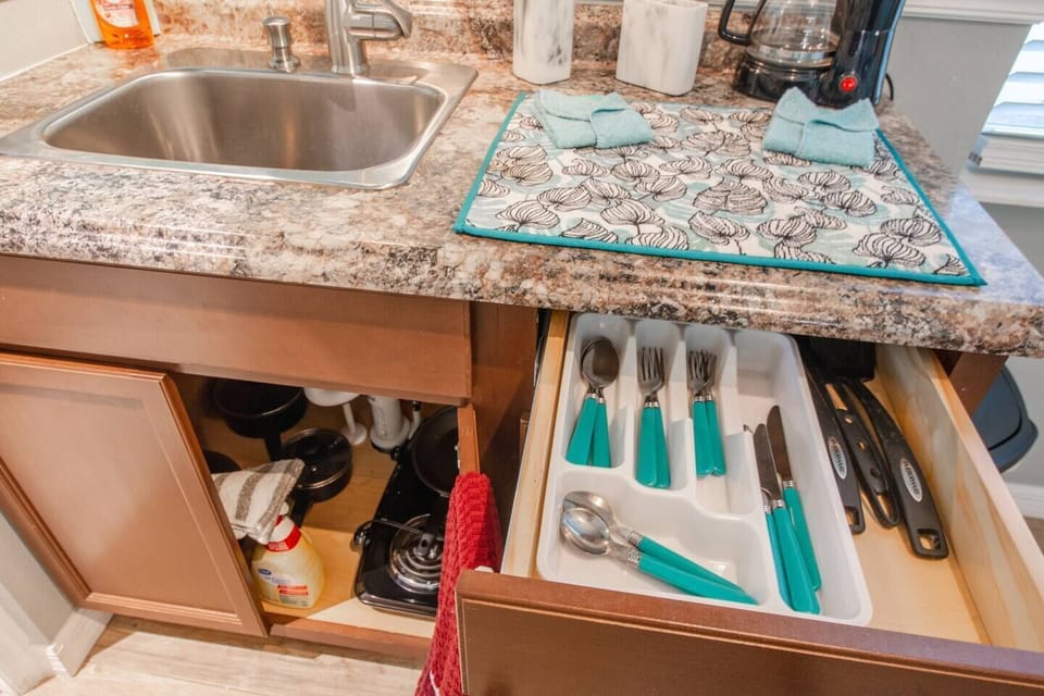 Kitchen cabinet with cutlery and utensils 
