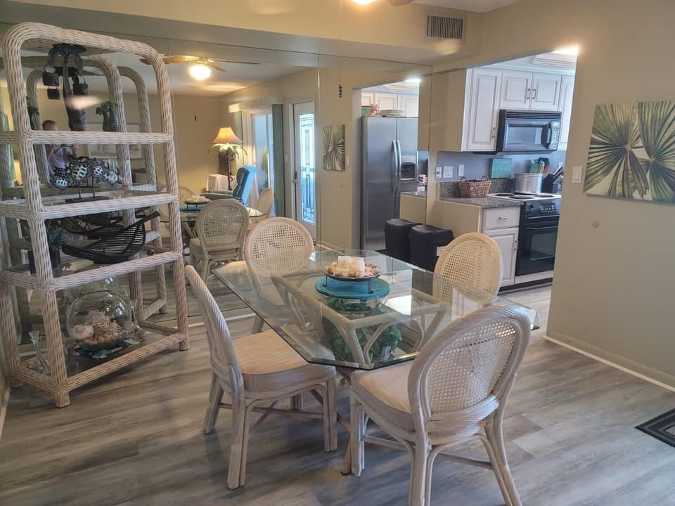 Open floor plan from kitchen to dining area and living room with a view.