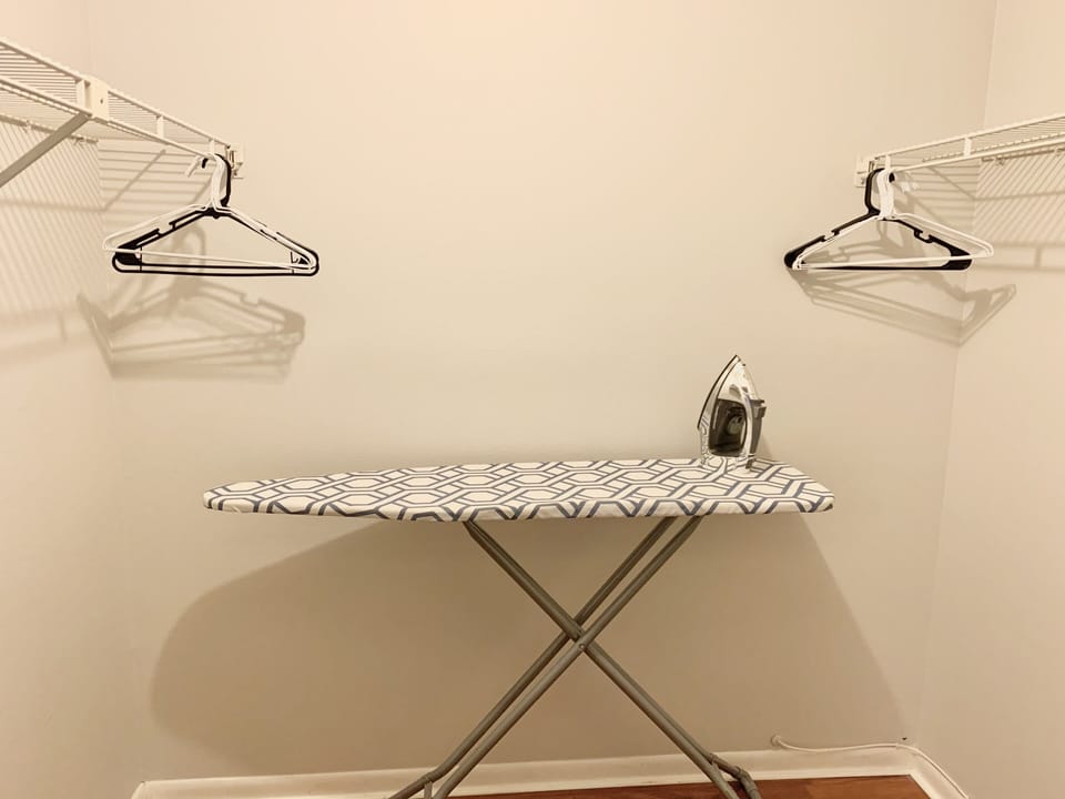 An iron and ironing board are provided