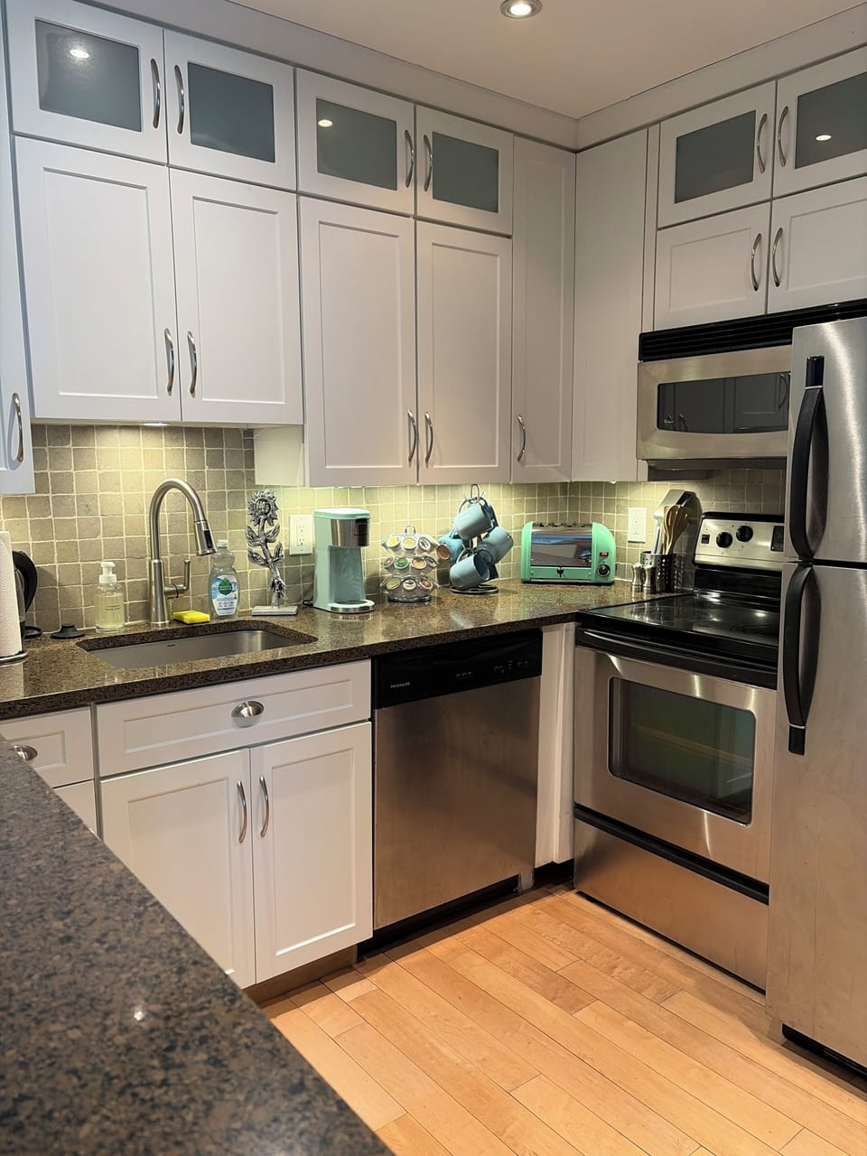 Updated kitchen with granite countertops.