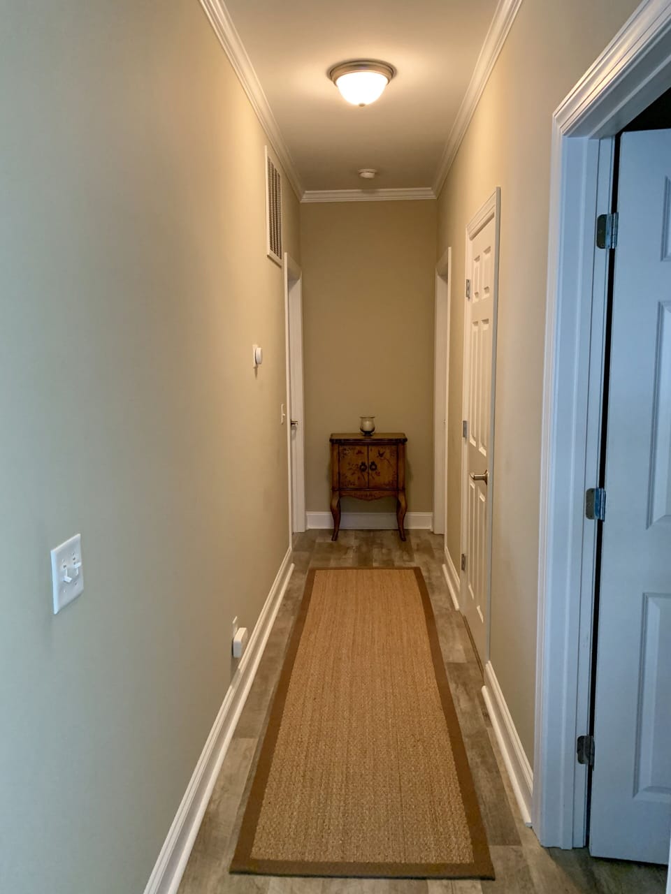 Hall with second master bedroom on left and twin guest bedroom on right.