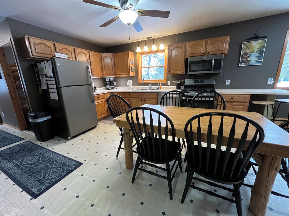 Large eat-in kitchen with refrigerator, stove, microwave and oven.