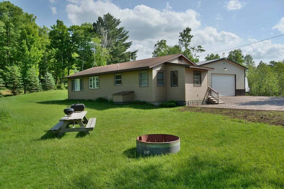 Inviting Grassy Yard with Firepit
