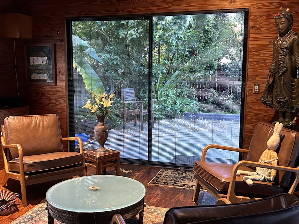 living room, with sliding glass door to the deck and garden
