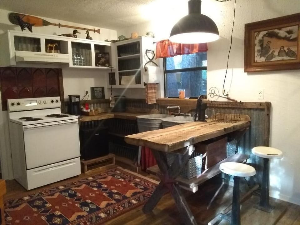 Great repurposed items in the kitchen plus stove, fridge, k-cup, and microwave