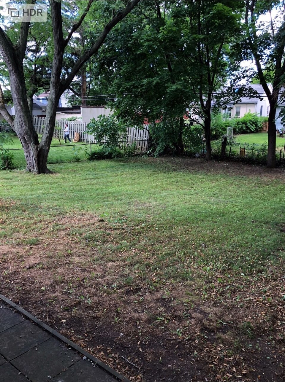Large fenced in shaded backyard