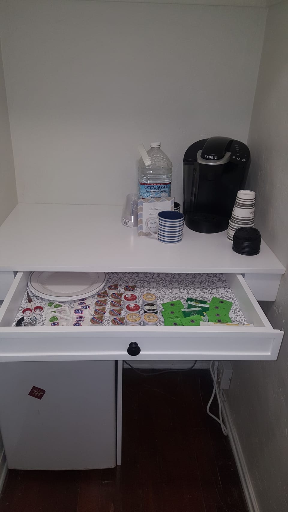 Kuereg with coffee and teas, help yourself. we have bottled water just for you.